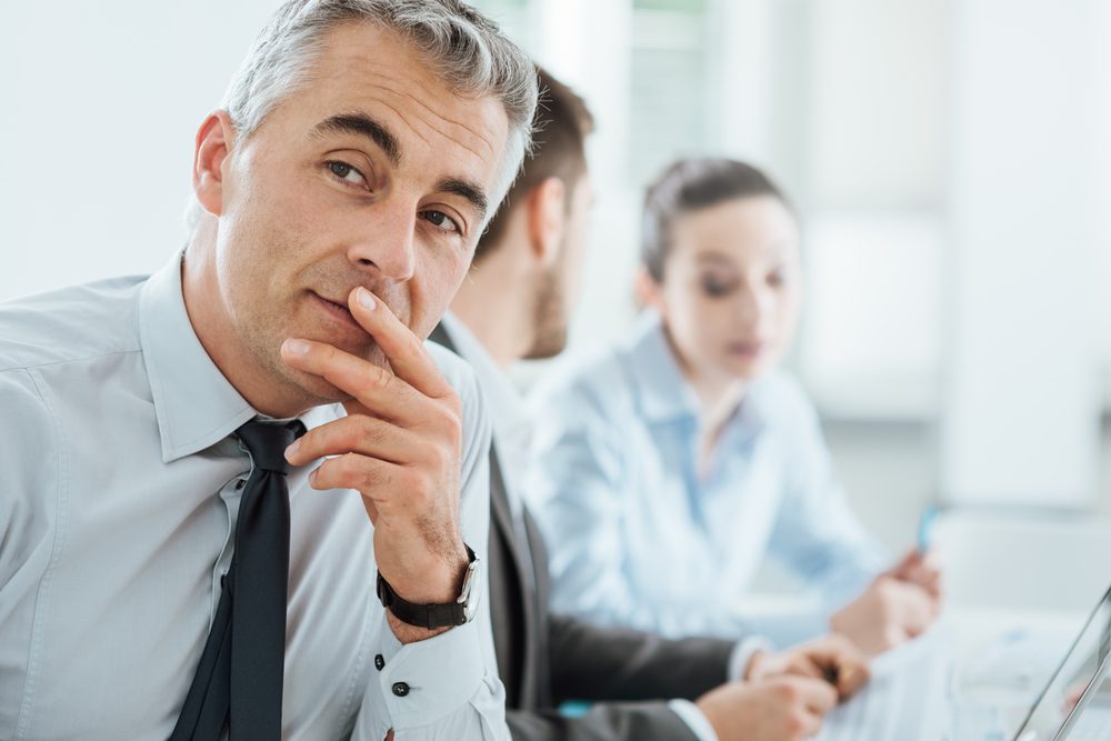 Executive thinking about his company's experience