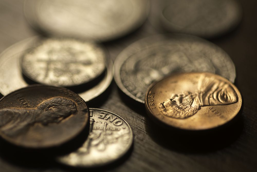 Pennies and other coins on a desk