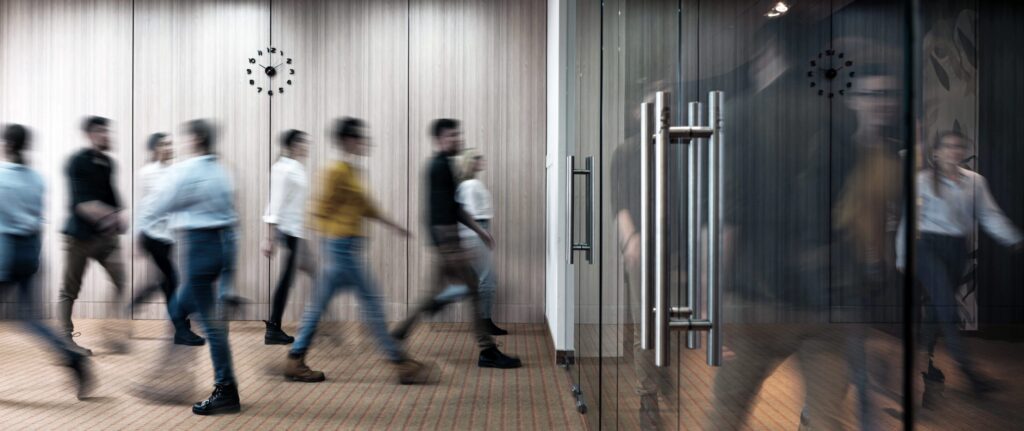 Blurry customers and employees leaving work