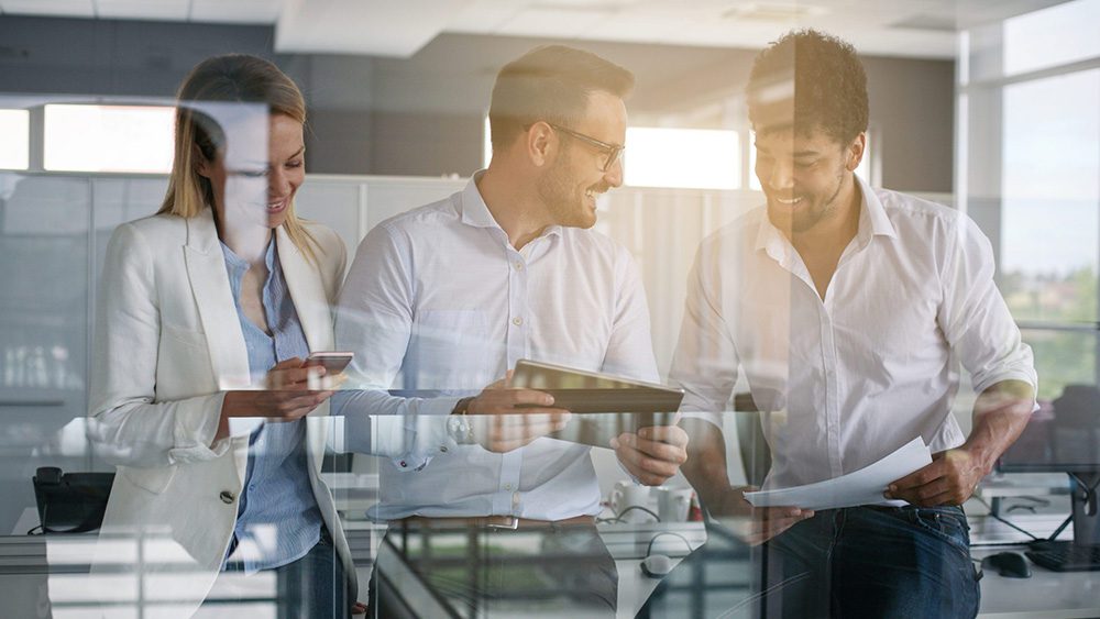 Happy employee team in office discuss