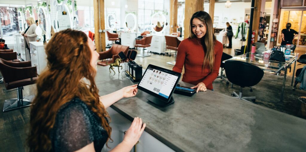 Customer engaged with employee cashier at shop