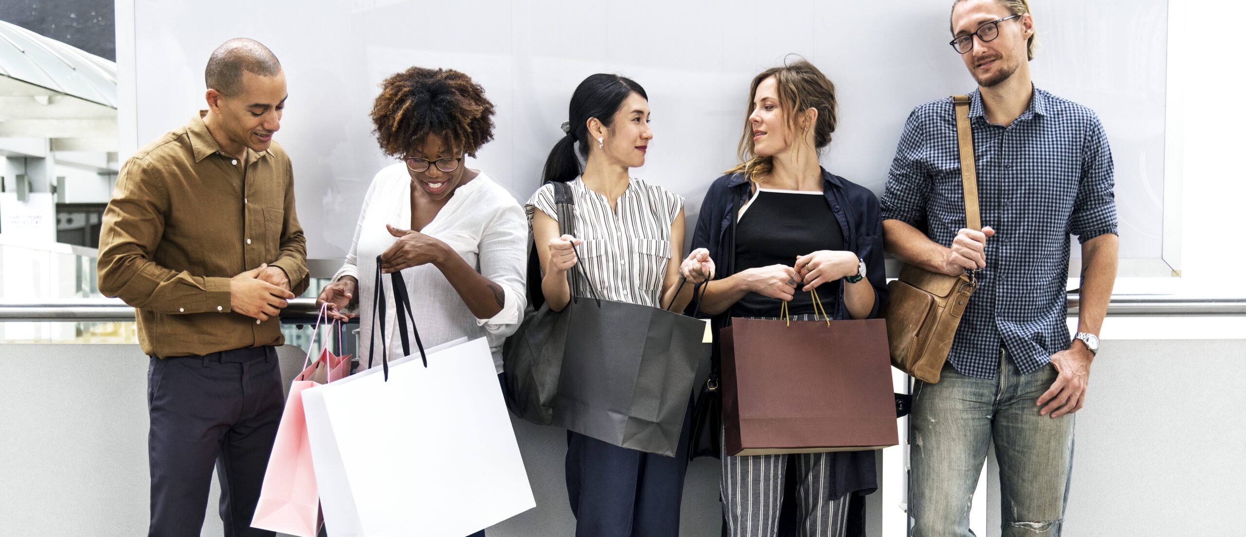 Diverse people with shopping bags